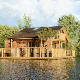 floating cabin runs on solar has hot tun and outdoor kitchen