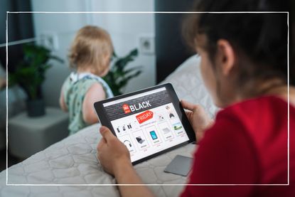 Shopping online Black Friday sales using a tablet at home