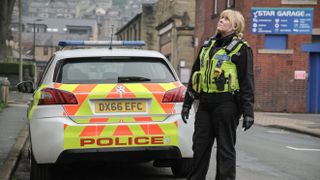Catherine (Sarah Lancashire) looking up in her police gear in Happy Valley season 3