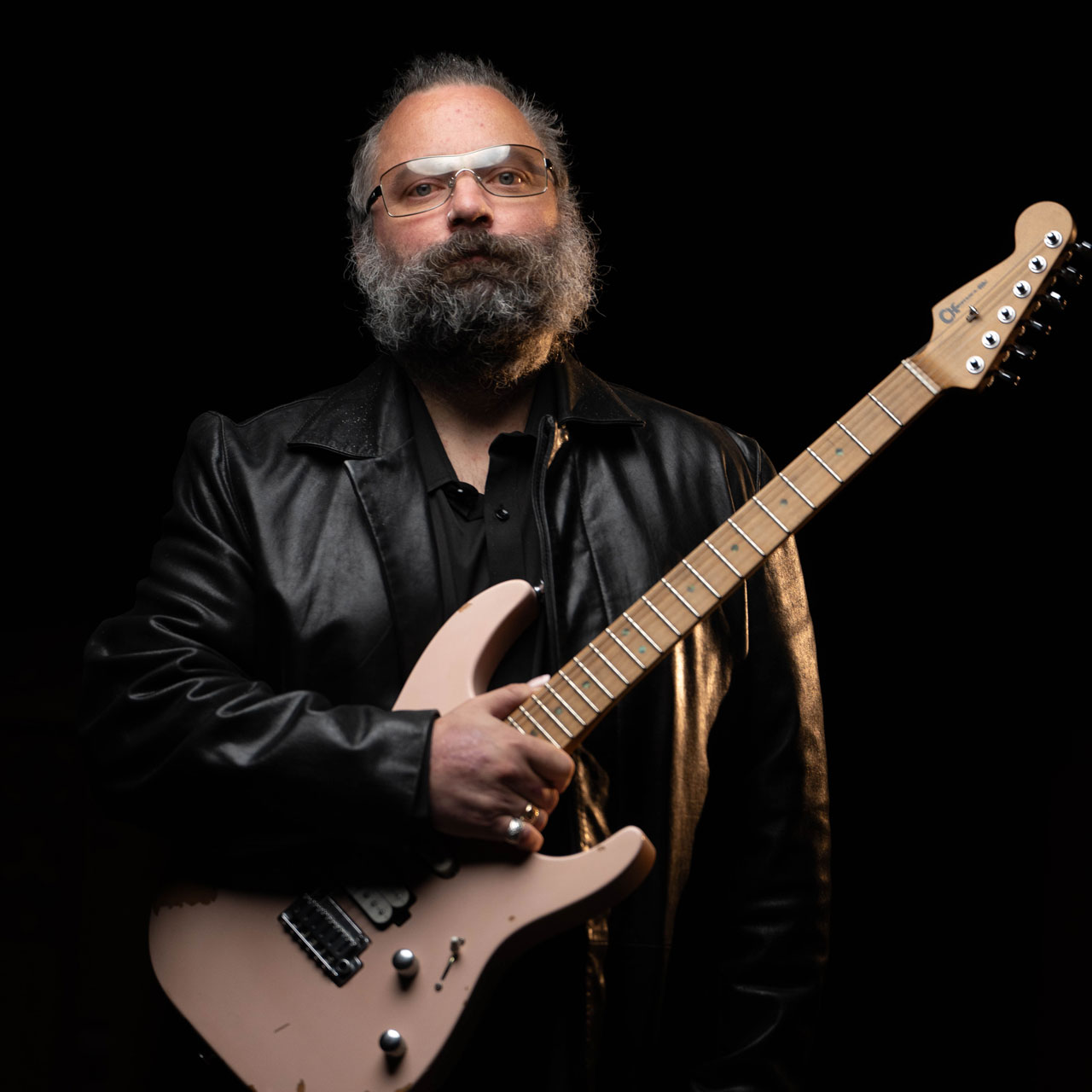 Rick Graham holds his Charvel Signature Pro-Mod DK24 2PT guitar, finished in Shell Pink