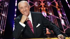 Len Goodman smiling and looking directly into the camera on the set of Dancing with the Stars