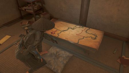 Assassin's Creed Shadows Naoe looking at map