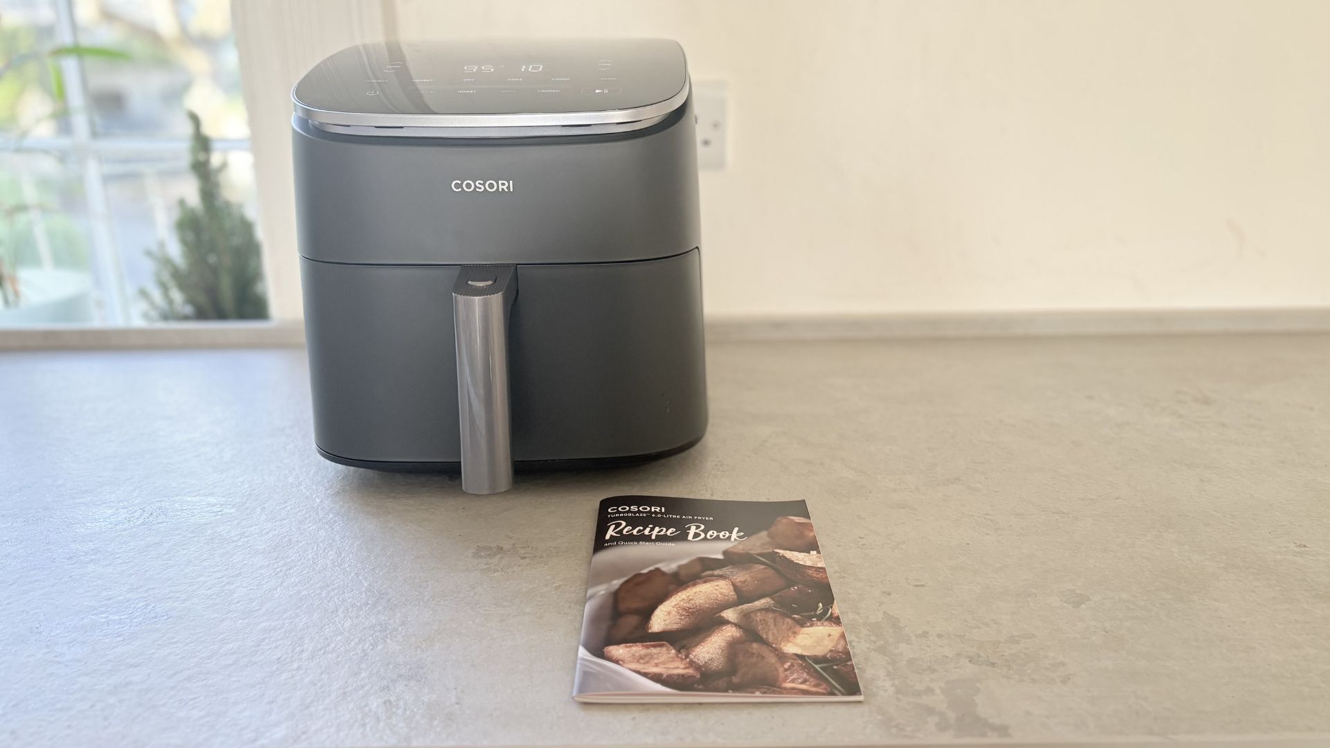 Testing the Cosori TurboBlaze 6L Air Fryer showing the recipe book