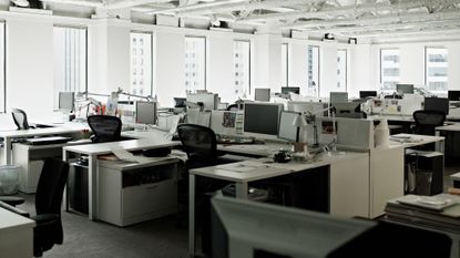 A stock photo of cubicles in an empty office building.