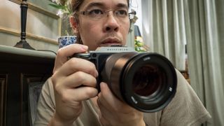 Hasselblad X1D II 50C being held by DCW Editor James Artaius