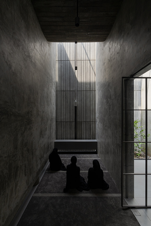 Brutalist mosque in Kerala, concrete structure moody interior
