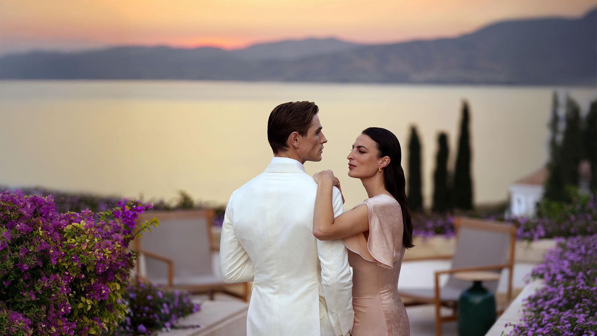 A couple enjoying a sunset outside the Anassa hotel in Cyprus