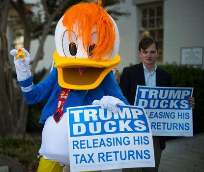 A protester demands the release of President Trump's tax returns