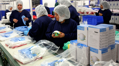 Medline workers assembling PPE kits