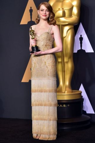 Emma Stone after winning her Best Actress Oscar for La La Land in 2017 - luckiest colour oscars