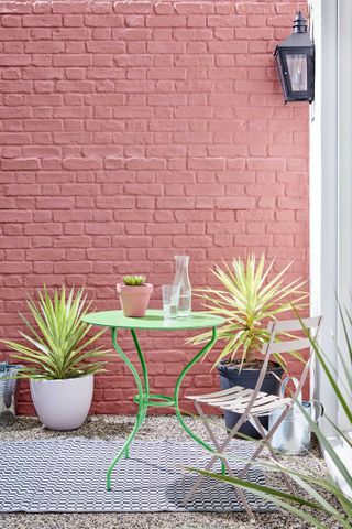 bistro set against pink wall with Annie Sloan shades