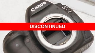 Canon EOS 5D Mark IV camera body shown on a white surface. A bold red banner with white text "DISCONTINUED" is overlaid across the image