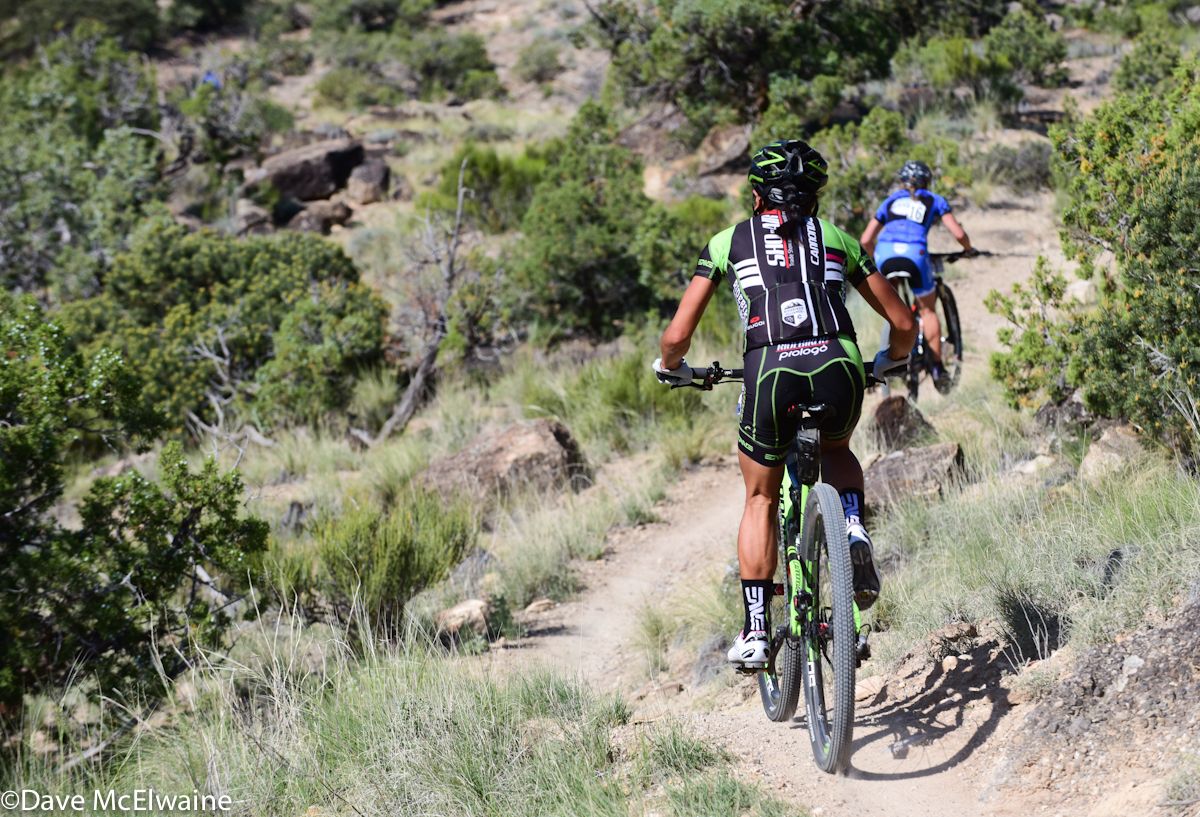 Evelyn Dong (Sho-Air Cannondale) descending singletrack behind Rebecca Hodgett (ALP Cycle Coaching)