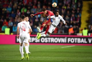 Danny Rose, right, challenges Patrik Schick for a high ball