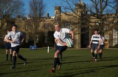 Boys practice on the fields at Rugby School, in England.
