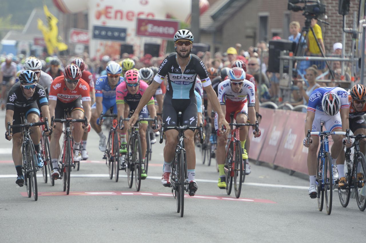 Boonen takes his hands off the bars ready for victory salute