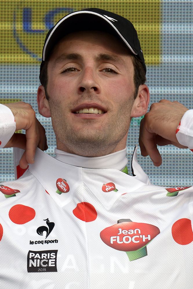 Jonathan Hivert puts his best climber's polka dot jersey on the podium at the end of the first stage.