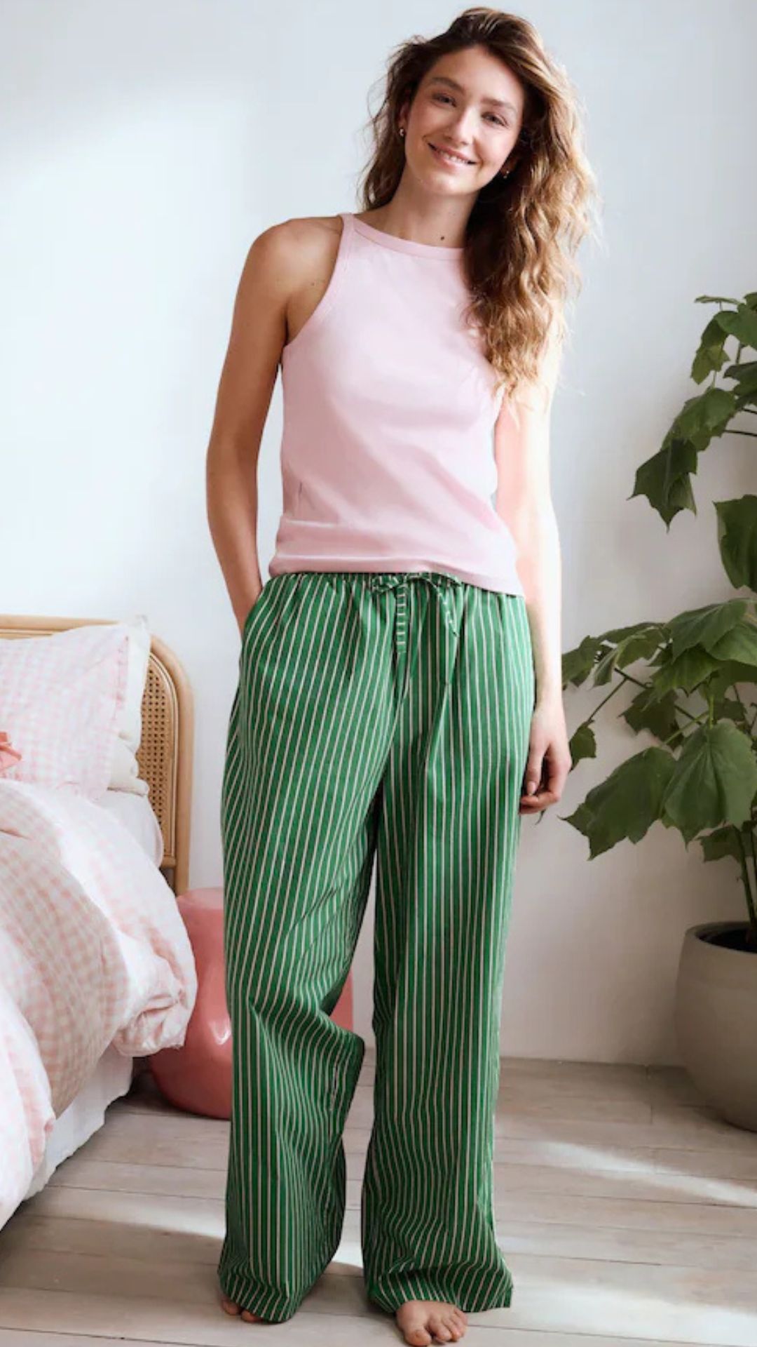 a model wearing a pink and green pyjama set