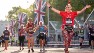 Runners at the finish line on The Mall. The TCS London Marathon on Sunday 2nd October 2022.