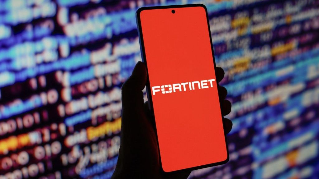  Fortinet logo is displayed on a smartphone screen in front of code background