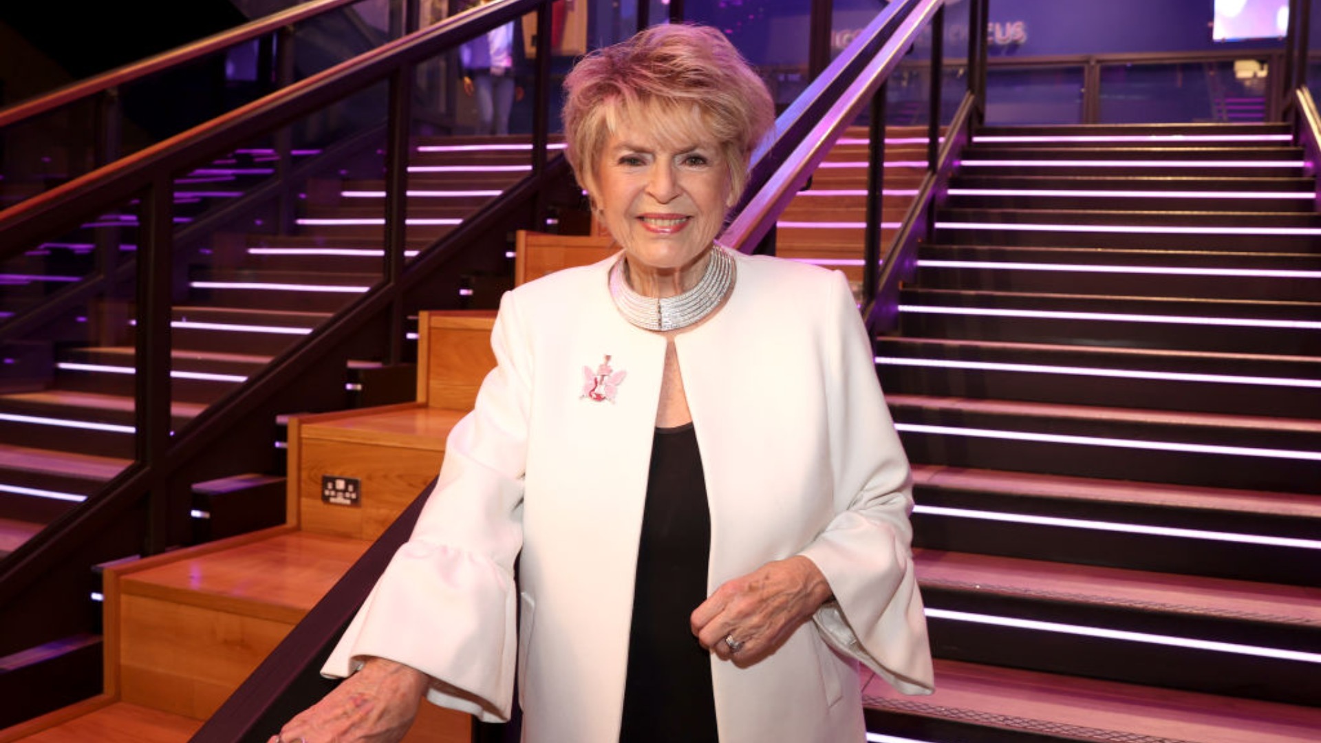 Gloria Hunniford poses for a photograph after accepting a cheque for &amp;pound;26,000 from the Hard Rock Cafe in donation to The Caron Keating Foundation