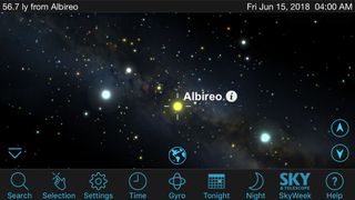 The SkySafari app renders in 3D the stars for which positions are known. This example shows Orbit View for the popular colored double-star Albireo in Cygnus. The primary yellow star has a nearby blue companion (at left). In this mode, you can view the pair from any angle and find the sun, shining in the distance.
