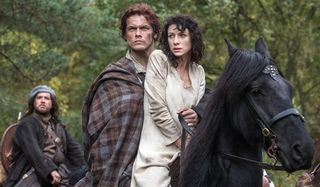 Outlander Jamie and Claire on horseback in ancient Scotland