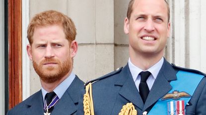 Prince Harry and Prince William watch a flypast to mark the centenary of the Royal Air Force from the balcony of Buckingham Palace on July 10, 2018 in London
