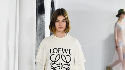 Model Milena Litvinovskaya walks the runway during the Loewe show