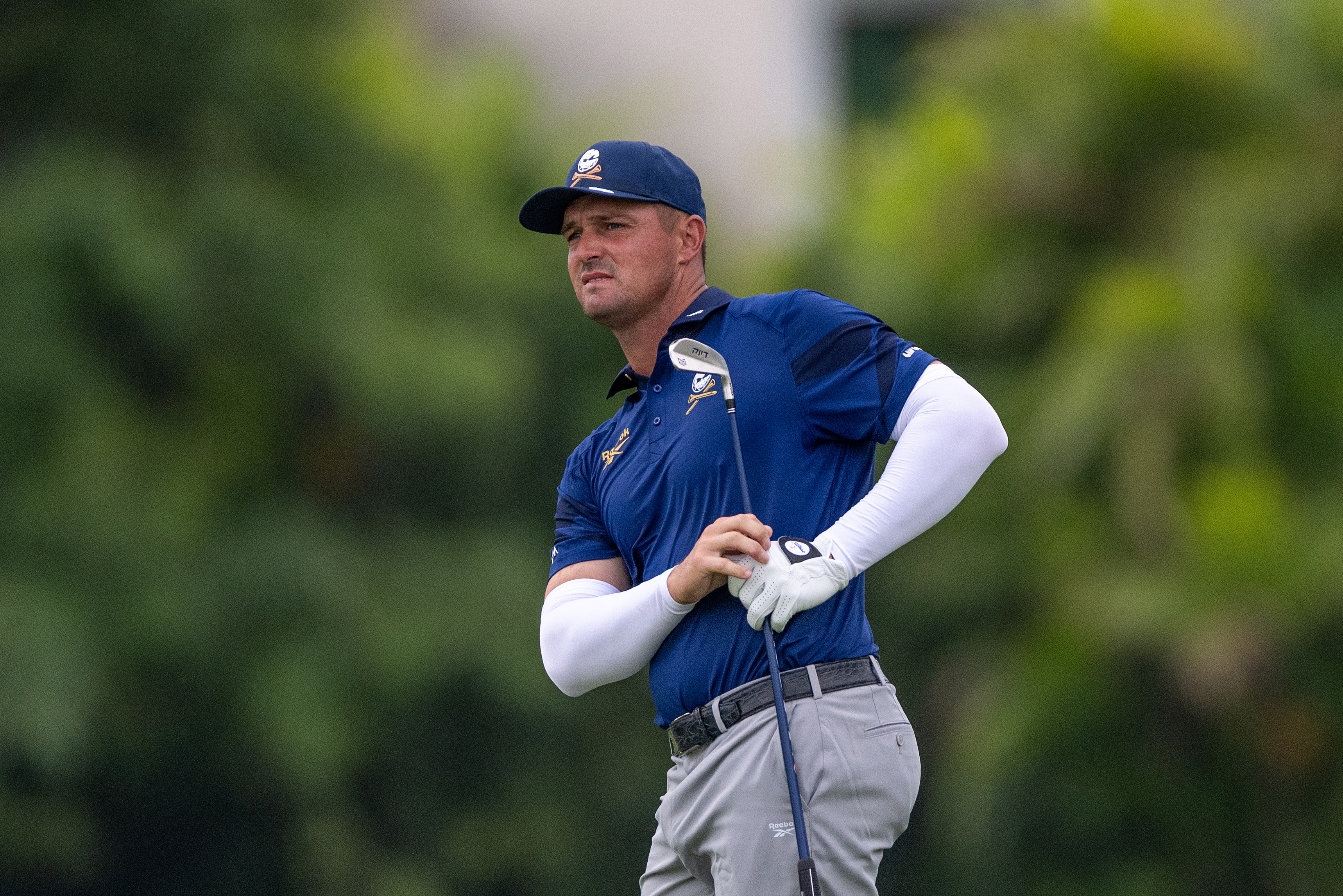Bryson DeChambeau hits an iron