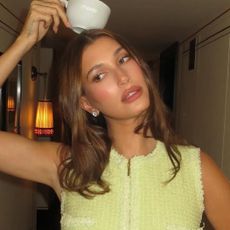 Hailey Bieber promoted Rhode in London wearing a lime green Chanel skirt set, which embodied a fall 2025 color trend