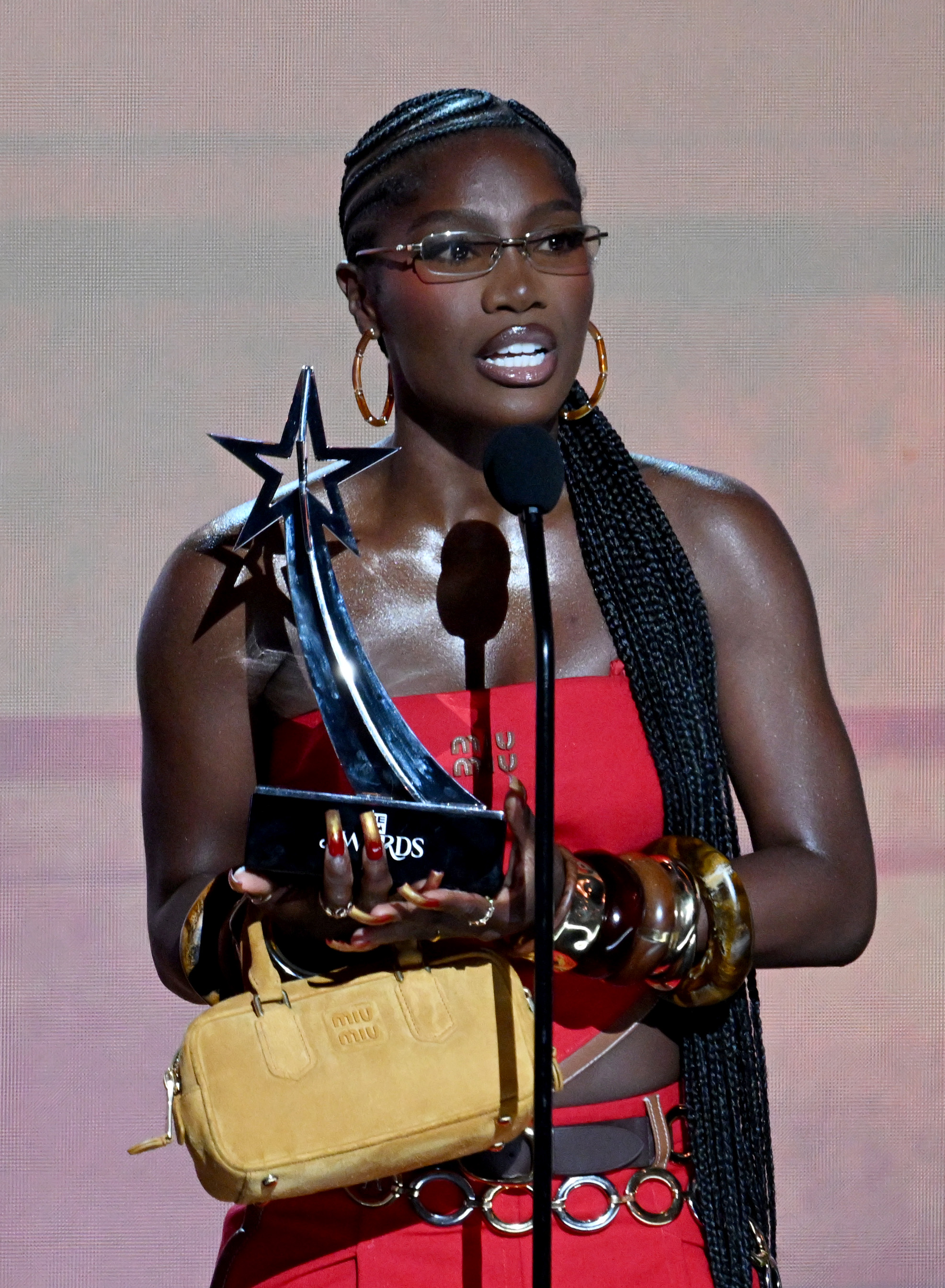 Doechii takes center stage at the 2025 BET Awards in a Miu Miu bandana set.