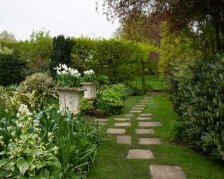 stepping stone path in cottage style garden