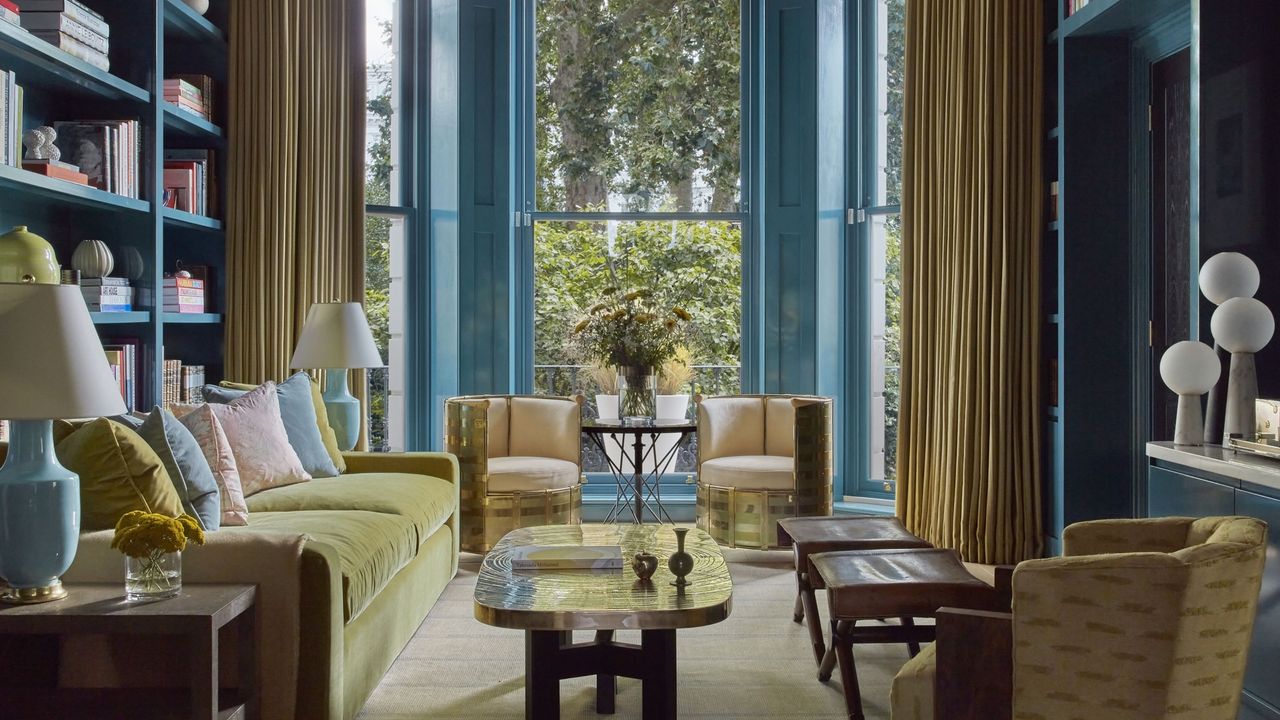 Image of a grand, traditional living room with glossy turquoise walls and golden yellow furniture.