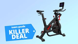 A photo of the Bowflex C7 exercise bike on a blue background, with the "Tom's Guide killer deal" tag overlaid