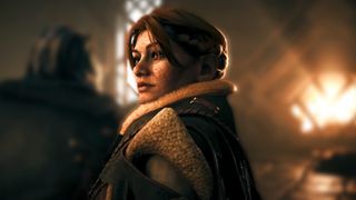 Dragon Age: The Veilguard reveal trailer screenshot showing Lace Harding, a dwarven woman with long red hair and a freckled face