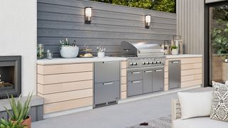 Outdoor kitchen ideas with wooden units and stainless steel oven