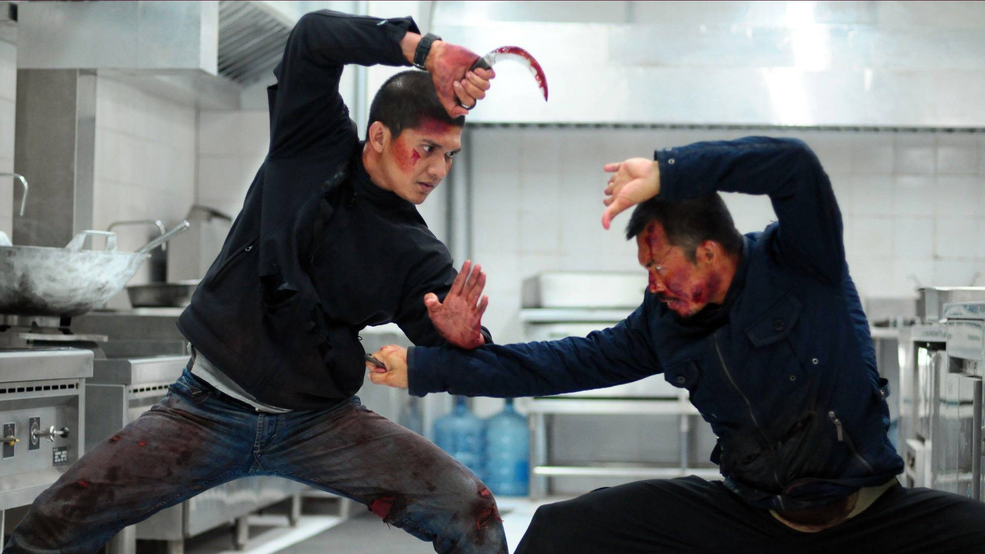 (L-R) Cecep Arif Rahman as The Assassins and Iko Uwais as Rama in 