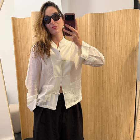 Anna LaPlaca wearing a Zara Satin-Effect Frog Closure Top