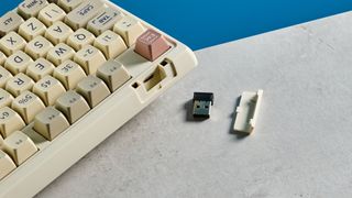 A beige, brown and off-white Epomaker RT100 wireless mechanical keyboard