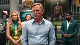 (L - R) Kate Hudson as Birdie, Jessica Henwick as Peg, Daniel Craig as Detective Benoit Blanc, and Leslie Odom Jr. as Lionel in Glass Onion: A Knives Out Mystery