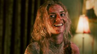 Samara Weaving as Grace laughing and covered in blood in Ready Or Not