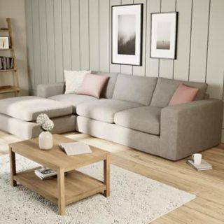 A beige corner sofa in a neutral living room