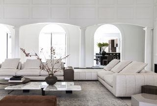 A living room made up of white and neutral tones