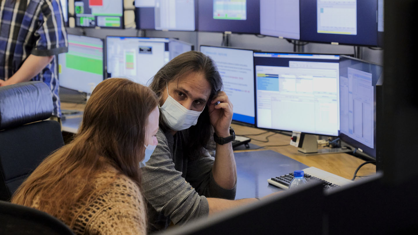 Scientists watch over the restart of the Large Hadron Collider on April 22, 2022 to begin Run 3 on the world's largest and most powerful particle accelerator.