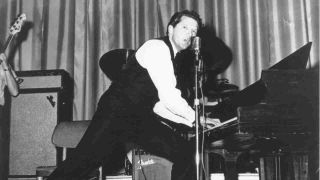 Jerry Lee Lewis playing piano onstage in the late 1950s