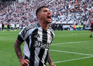 Newcastle United's Bruno Guimaraes celebrates his side's Champions League spot with fans after the Premier League match between Newcastle United FC and Everton FC at St James' Park on May 25, 2025 in Newcastle upon Tyne, England.