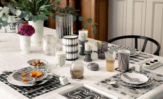 diptyque 60th anniversary entertaining and tableware collection decorated with black and white patterns