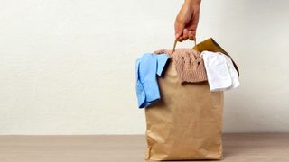 paper bag of decluttering clothes