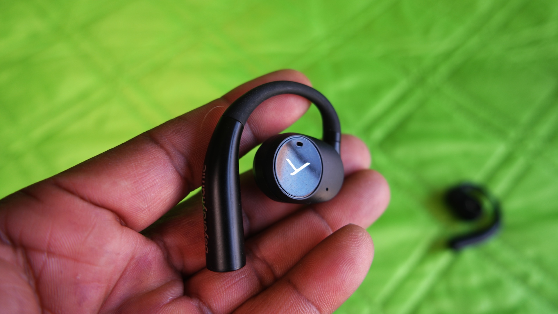 Beyerdynamic Verio 200 in hand, showing the outside of the earbud